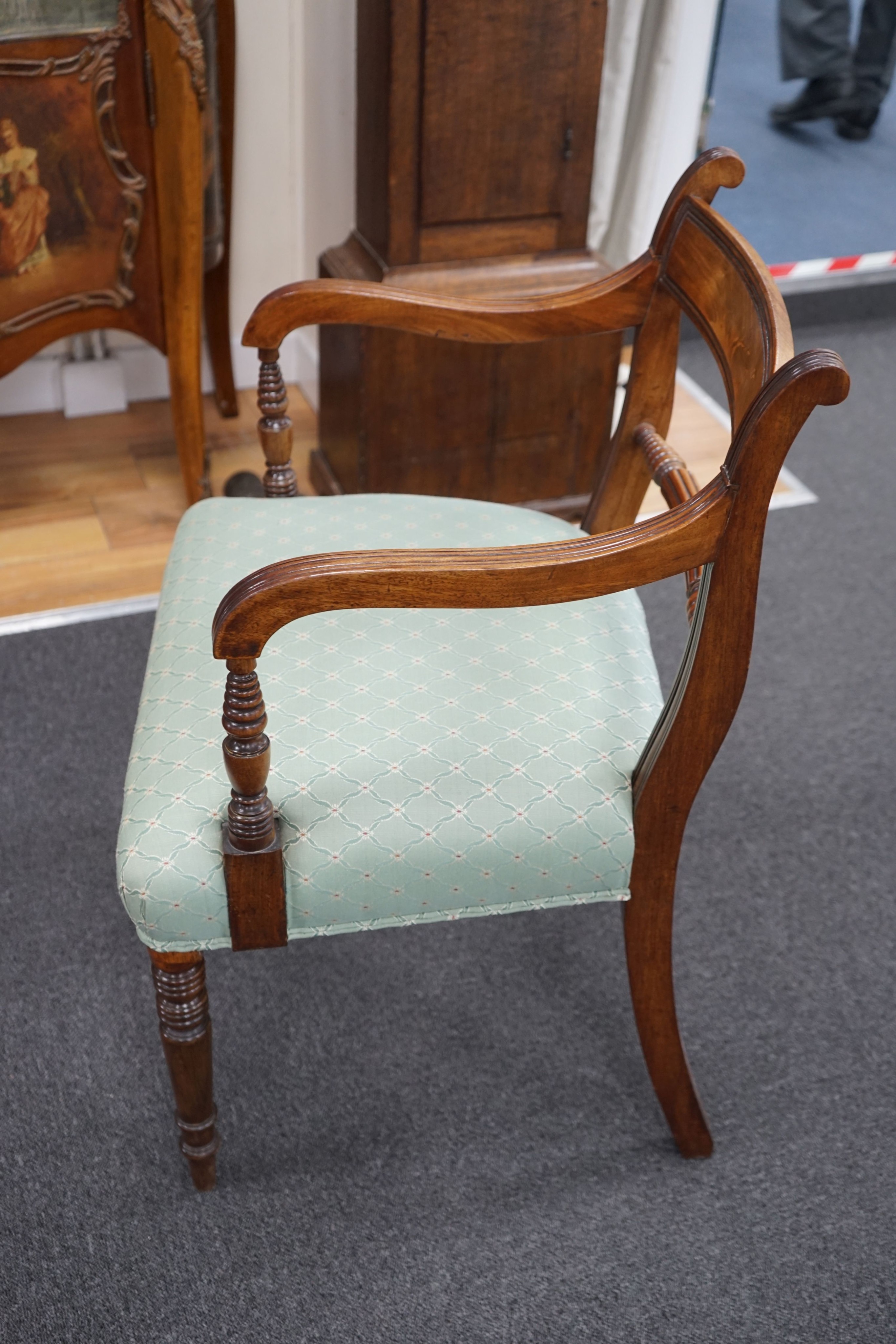 A set of eight Regency mahogany dining chairs with fluted spars, two with arms